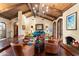 Bright living room with hardwood floors, fireplace, beamed ceiling, comfortable seating, and elegant decor at 8306 N Merion Way, Paradise Valley, AZ 85253