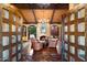 Inviting living room with fireplace and large windows offering serene backyard views at 8306 N Merion Way, Paradise Valley, AZ 85253