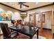 Well-appointed office featuring wood trim, built-in bookshelves, a modern desk setup, and natural light at 8306 N Merion Way, Paradise Valley, AZ 85253