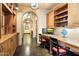Stylish home office with arched entry, custom built-ins, ample desk space, and modern decor at 8306 N Merion Way, Paradise Valley, AZ 85253