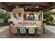Charming outdoor dining area featuring a large table, comfortable seating, and stylish decor at 8306 N Merion Way, Paradise Valley, AZ 85253