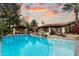 Large backyard pool with cabana, outdoor kitchen, and mature landscaping creates a private retreat at 8306 N Merion Way, Paradise Valley, AZ 85253