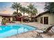 Lush backyard pool and patio with mature landscaping, lounge seating, and inviting outdoor space at 8306 N Merion Way, Paradise Valley, AZ 85253
