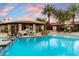 Amazing backyard pool with a sunken bar area, desert plants, and a covered outdoor kitchen space at 8306 N Merion Way, Paradise Valley, AZ 85253