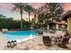 Beautiful pool area with a serene ambiance, lush landscaping, and comfortable outdoor seating arrangement at 8306 N Merion Way, Paradise Valley, AZ 85253