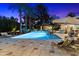 Large pool and patio area with outdoor kitchen, dining space, lounge seating, and mature desert landscaping at 8306 N Merion Way, Paradise Valley, AZ 85253