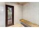 Shower with a bench, decorative door and marble tile at 8306 N Merion Way, Paradise Valley, AZ 85253