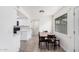 Bright dining room with wood table, seating for six, and lots of natural light at 8532 E Belleview St, Scottsdale, AZ 85257