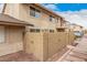 Exterior view of the home with a private patio area and a second-story balcony at 8532 E Belleview St, Scottsdale, AZ 85257