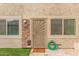 Charming exterior featuring a secure front door, manicured yard, and updated stone accents at 8532 E Belleview St, Scottsdale, AZ 85257
