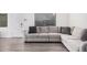 Comfortable living area with a plush sectional sofa, bright window and luxury vinyl plank flooring at 8532 E Belleview St, Scottsdale, AZ 85257