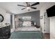 Comfortable bedroom featuring a ceiling fan, neutral paint colors, and lots of natural light at 869 E Tee St, San Tan Valley, AZ 85140