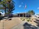 Community clubhouse with covered patio, picnic table, and lush green landscaping at 869 E Tee St, San Tan Valley, AZ 85140