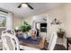 Cozy dining area showcasing a modern table setting, view of living room, and natural light at 869 E Tee St, San Tan Valley, AZ 85140