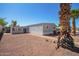 Home exterior showing large yard with brick pathway at 8823 E Billings St, Mesa, AZ 85207