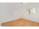 Bright bedroom with hardwood floors and a window offering an outside view at 8823 E Billings St, Mesa, AZ 85207