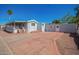 Manufactured home featuring a detached garage, covered porch, and a long driveway at 8823 E Billings St, Mesa, AZ 85207