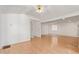Living room featuring hardwood floors, white walls, a ceiling fan, and baseboards at 8823 E Billings St, Mesa, AZ 85207