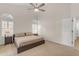 Bright main bedroom with neutral colors, high ceilings, and carpet floors at 1229 E Glenhaven Dr, Phoenix, AZ 85048