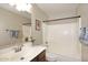 Bathroom featuring decorative lighting, single sink vanity, and shower-tub combination at 1293 E Clifton Ave, Gilbert, AZ 85295