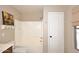 Bathroom with tiled shower-tub, neutral walls and a white door at 1293 E Clifton Ave, Gilbert, AZ 85295