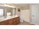 Bathroom featuring double sinks, decorative lighting, and a shower-tub combination at 1293 E Clifton Ave, Gilbert, AZ 85295