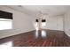 Spacious bedroom with beautiful wood floors, neutral walls, and a ceiling fan at 1293 E Clifton Ave, Gilbert, AZ 85295
