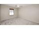 Bedroom features neutral paint, carpet floors, and a ceiling fan at 1293 E Clifton Ave, Gilbert, AZ 85295