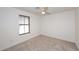 Cozy bedroom with neutral colored walls, carpet floors, and a ceiling fan at 1293 E Clifton Ave, Gilbert, AZ 85295