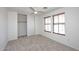 Bright bedroom featuring a ceiling fan, neutral paint, and a closet at 1293 E Clifton Ave, Gilbert, AZ 85295