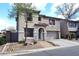 Inviting two-story home with neat landscaping, an American flag, and attached two car garage at 1293 E Clifton Ave, Gilbert, AZ 85295