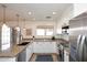 Modern kitchen with stainless steel appliances, granite countertops and ample cabinet space at 1293 E Clifton Ave, Gilbert, AZ 85295