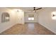 Living room with neutral walls, tile floors, and ample natural light from several windows at 1293 E Clifton Ave, Gilbert, AZ 85295