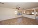 Bright living room with decorative ceiling fan, neutral walls, and tiled floors at 1293 E Clifton Ave, Gilbert, AZ 85295
