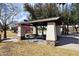 Community park featuring a covered picnic area with BBQ and tables, and a colorful playground for  at 1293 E Clifton Ave, Gilbert, AZ 85295