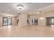 Expansive living room with tile flooring, open floor plan, and natural light at 13317 W Serenade Cir, Sun City West, AZ 85375