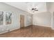 A bright living room with wood floors, neutral walls, and a ceiling fan at 137 N Wilbur --, Mesa, AZ 85201