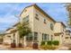 Well-maintained townhome with desert landscaping, several windows offering natural light, and a neutral-toned stucco exterior at 14870 W Encanto Blvd # 1008, Goodyear, AZ 85395