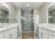 Modern bathroom features double vanities, quartz countertops, and a marble-tiled walk-in shower at 15050 N Thompson Peak Pkwy # 2036, Scottsdale, AZ 85260