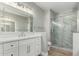 Contemporary bathroom with double vanities, quartz countertops, and a large walk-in shower at 15050 N Thompson Peak Pkwy # 2036, Scottsdale, AZ 85260