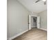 Spacious bedroom with new wood flooring and entry to an en-suite bathroom at 15050 N Thompson Peak Pkwy # 2036, Scottsdale, AZ 85260