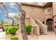 Condominium exterior showcasing a well-maintained lawn and two-story facade at 15050 N Thompson Peak Pkwy # 2036, Scottsdale, AZ 85260