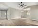 Expansive living space featuring wood-look floors, neutral walls, recessed lights, and natural light at 15050 N Thompson Peak Pkwy # 2036, Scottsdale, AZ 85260