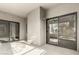 Outdoor patio featuring textured walls and sliding glass doors to the home's interior at 15050 N Thompson Peak Pkwy # 2036, Scottsdale, AZ 85260