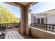 This balcony area has an outdoor dining set and views of the community and greenery at 15221 N Clubgate Dr # 2012, Scottsdale, AZ 85254
