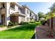 Beautifully landscaped condo community with lush green lawns and mature trees at 15221 N Clubgate Dr # 2012, Scottsdale, AZ 85254