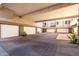 Parking garage with multiple garage doors and paver drive at 15221 N Clubgate Dr # 2012, Scottsdale, AZ 85254