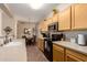 Bright kitchen with a dining area, stainless appliances, and tile flooring at 15221 N Clubgate Dr # 2012, Scottsdale, AZ 85254