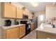 Functional kitchen with light cabinets, stainless steel appliances, and ample counter space at 15221 N Clubgate Dr # 2012, Scottsdale, AZ 85254