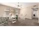 Inviting living room area featuring a ceiling fan, a small desk and an open floor plan at 15221 N Clubgate Dr # 2012, Scottsdale, AZ 85254